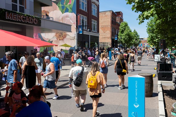 a photo showing the main street of the landing crowded with Fort Wayne Metals families